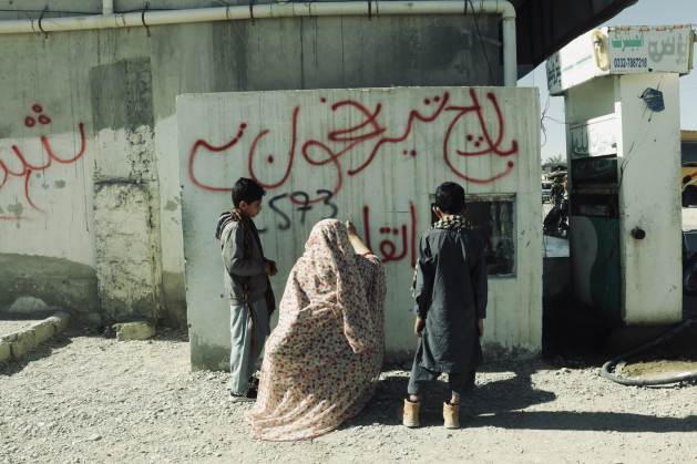 A protester makes graffiti in a Baloch town. The participants have had to reconcile activism and family for weeks. Credit: Baloch Yakjehti Committee